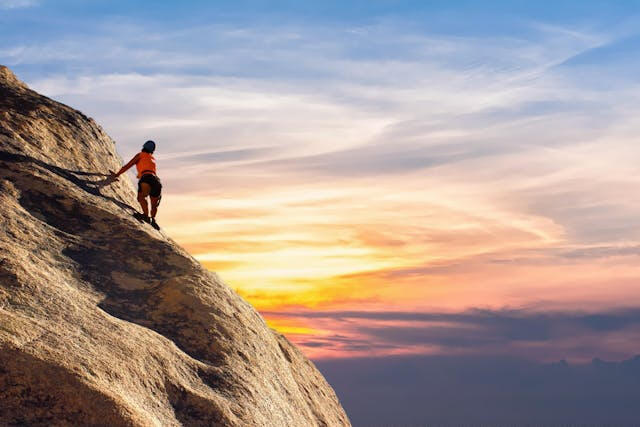 Utah County website design & SEO represented by a person climbing a mountain